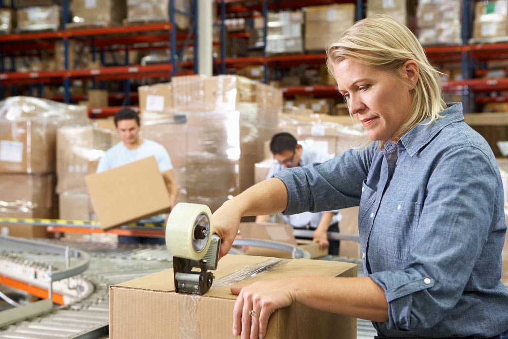 A woman in the Xcel Fulfillment warehouse